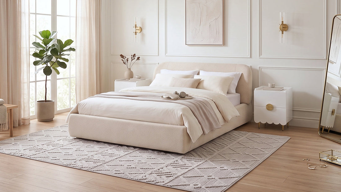 Cream upholstered bed with neutral bedding in elegant bright bedroom