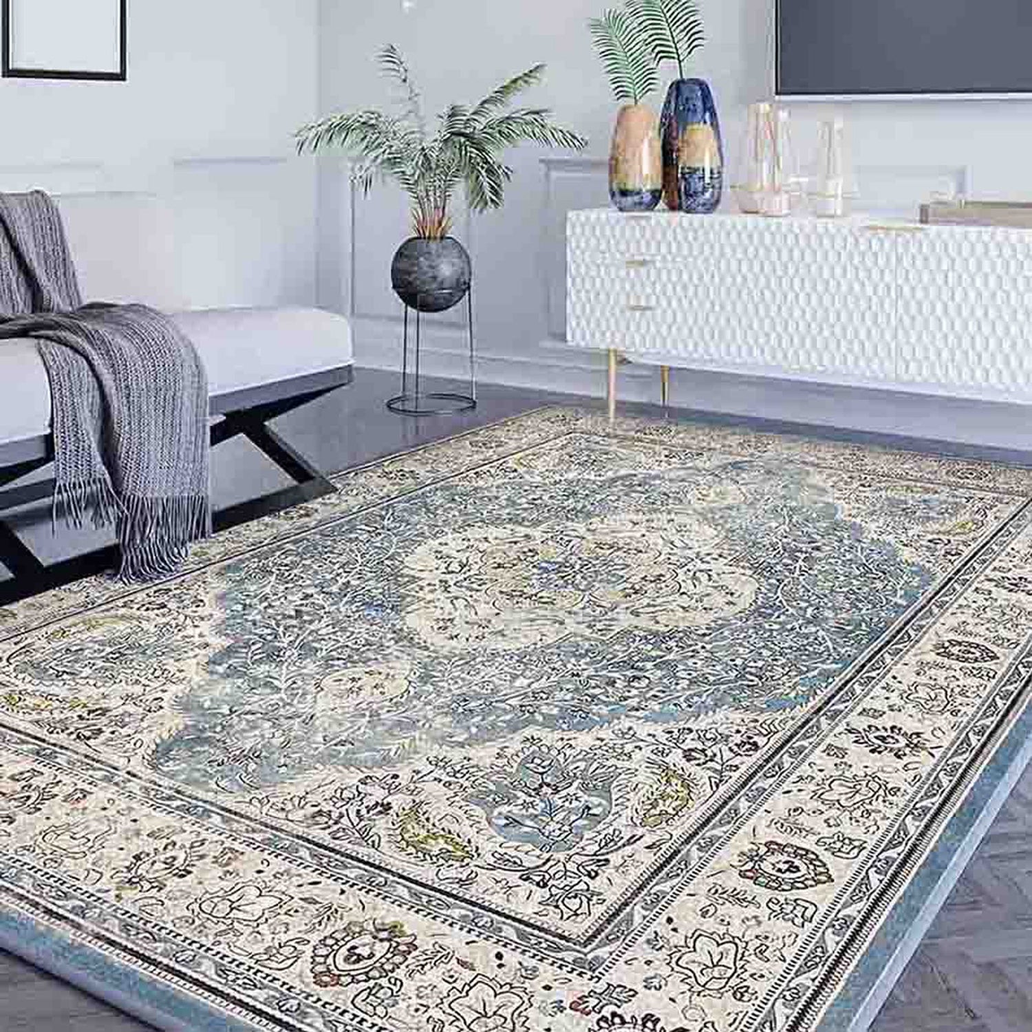 Traditional Persian-style rug with an intricate floral medallion pattern in blue and cream