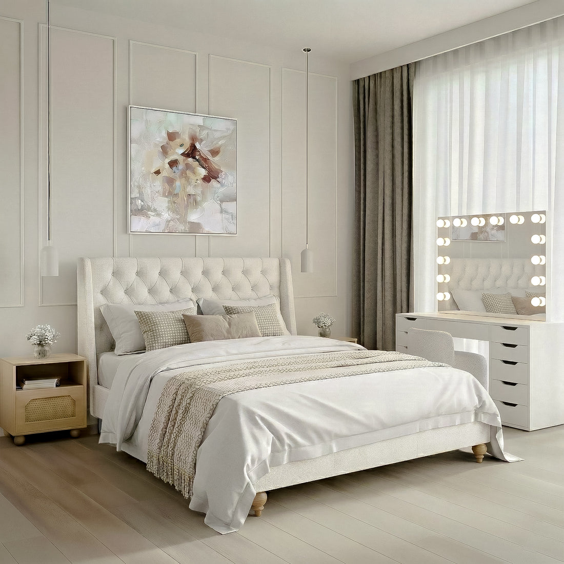 Master suite featuring a white tufted wingback bed frame with neutral bedding, flanked by light wood bedside tables and white pendant lights. Includes a large white vanity desk with a lit Hollywood-style mirror and abstract floral wall art in a modern wainscoted room.