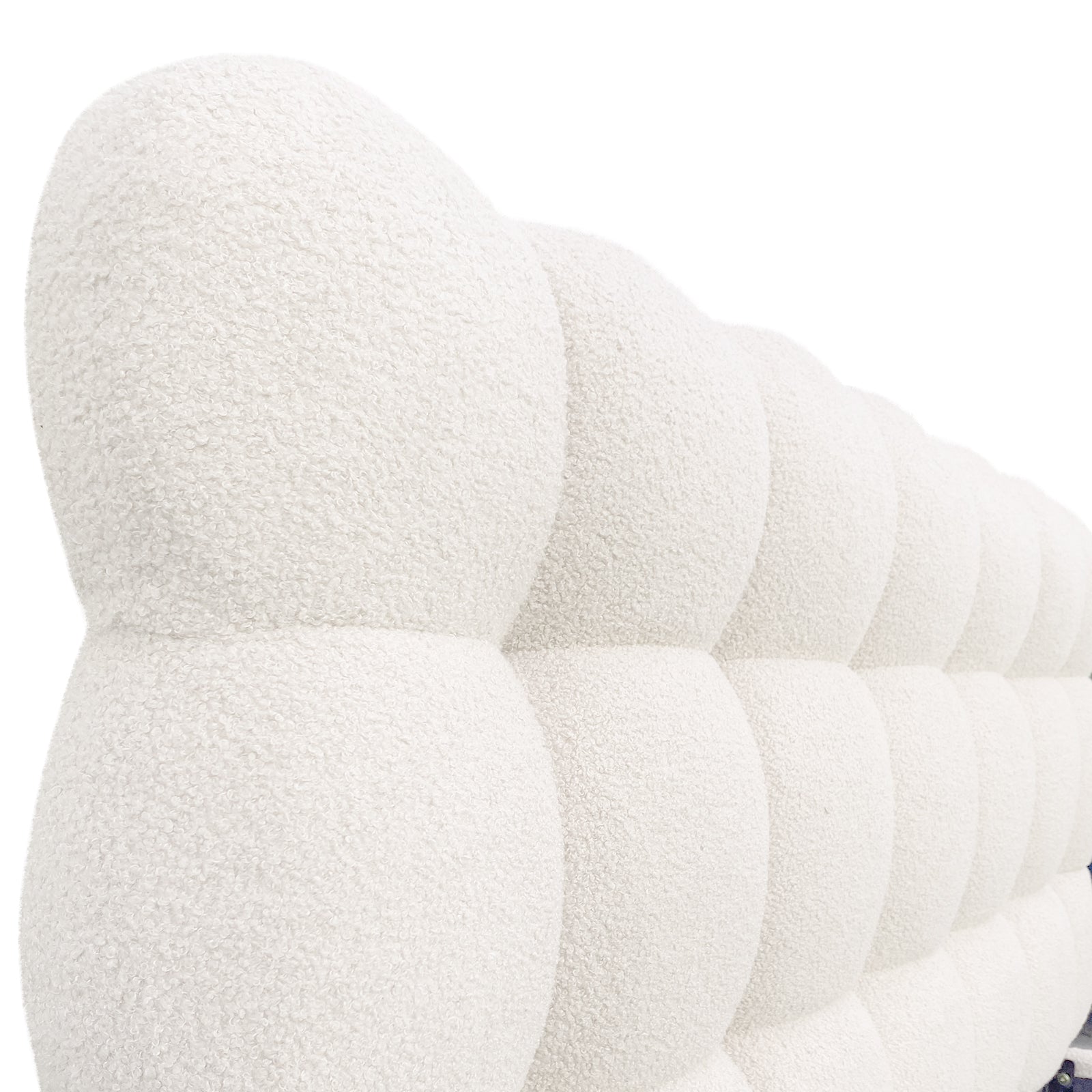 Close-up of the Aina Queen Boucle Bed Frame in Cream White, showcasing its tufted bouclé-style headboard with a nubby texture and grid-like, sculptural, padded surface.