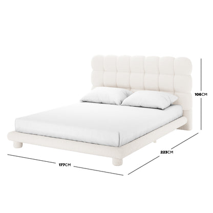 Aina Queen Boucle Bed Frame in Cream White features a cushioned, grid-tufted headboard with white bouclé fabric, styled with two pillows and a fitted sheet, measuring 177cm wide, 223cm long, and 106cm tall.