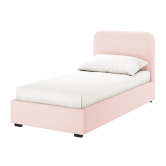 Carya Kids Single Fabric Bouclé Bed Frame in Light Pink; twin-size, pastel pink upholstered frame with rounded headboard, white mattress, pillow, and dark block feet, showcasing a cozy, elegant design for children's rooms.