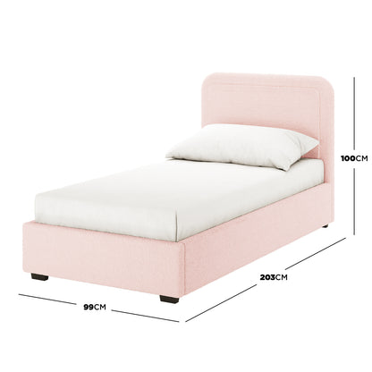 Carya Kids Single Fabric Boucle Bed Frame in Light Pink, twin-sized, features a rounded headboard, white fitted sheet, single pillow, and dimensions: 99 cm wide, 203 cm long, 100 cm tall.