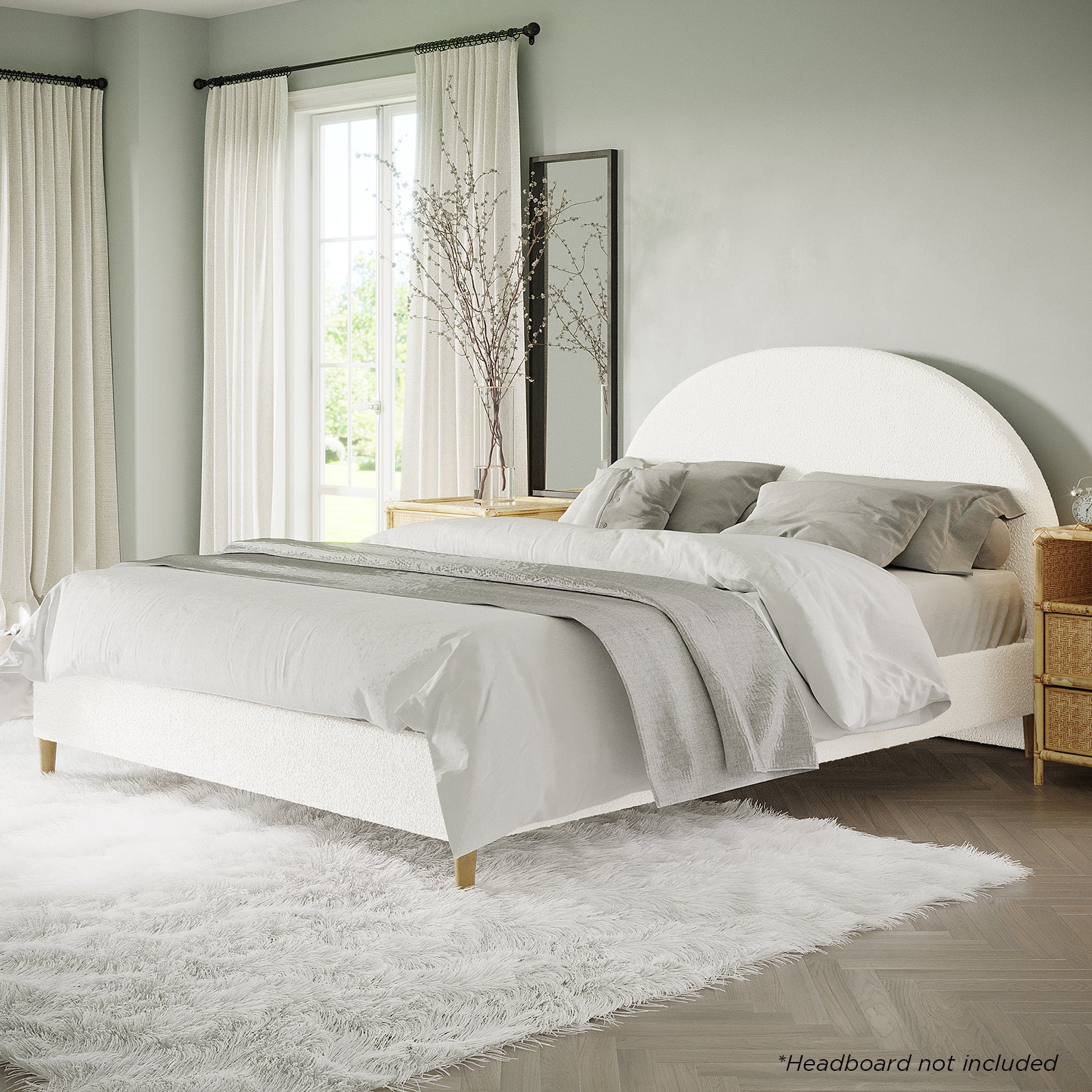 Celina Queen Boucle Fabric Bed Base in Cream White, featuring textured upholstery, low-profile design, plush linens, and sturdy timber legs, nestled on a shaggy rug in a bright, minimalist bedroom setting.