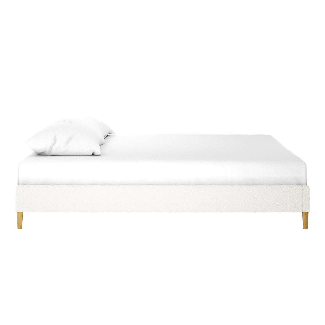 Celina Queen Boucle Fabric Bed Base in Cream White features a minimalist, low-profile upholstered frame on short wooden legs, topped with a white mattress and two pillows, showcasing luxury and modern design.
