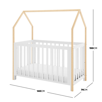 Damaris Solid Pine Baby Cot Bed - White/Natural features a house-shaped frame with four natural wood posts, a white slatted base, and a mattress inside, measuring 140 x 74 x 150 cm.