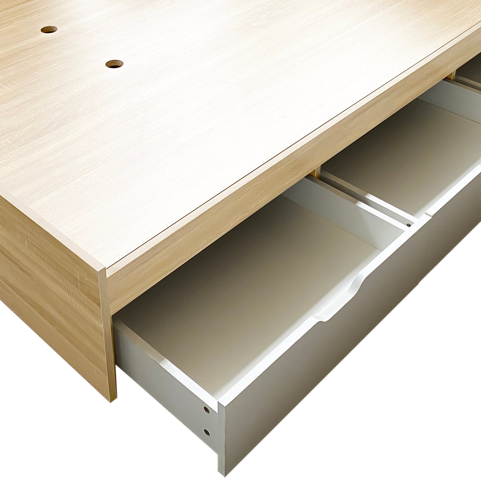 Fabiola Queen Storage Bed Base with Drawers in White & Oak, showcasing a light wood finish with white drawers and two round cable-management holes, highlighting the bed's functional and stylish design.