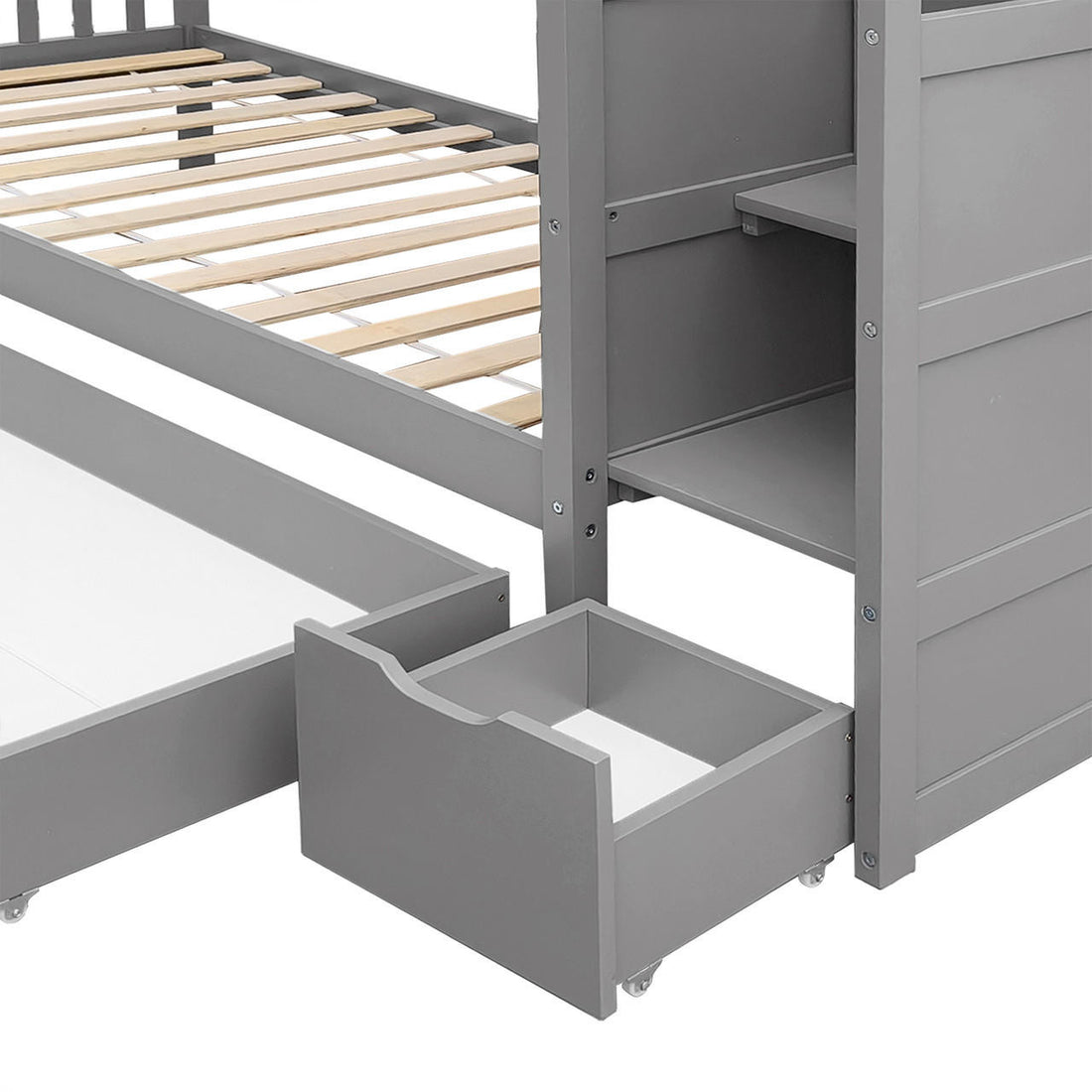 Flavia Solid Pine Wood Staircase Storage Bunk Bed in Grey, featuring a sturdy wooden frame with top slatted supports, integrated shelving, and a pull-out trundle drawer on caster wheels beneath.