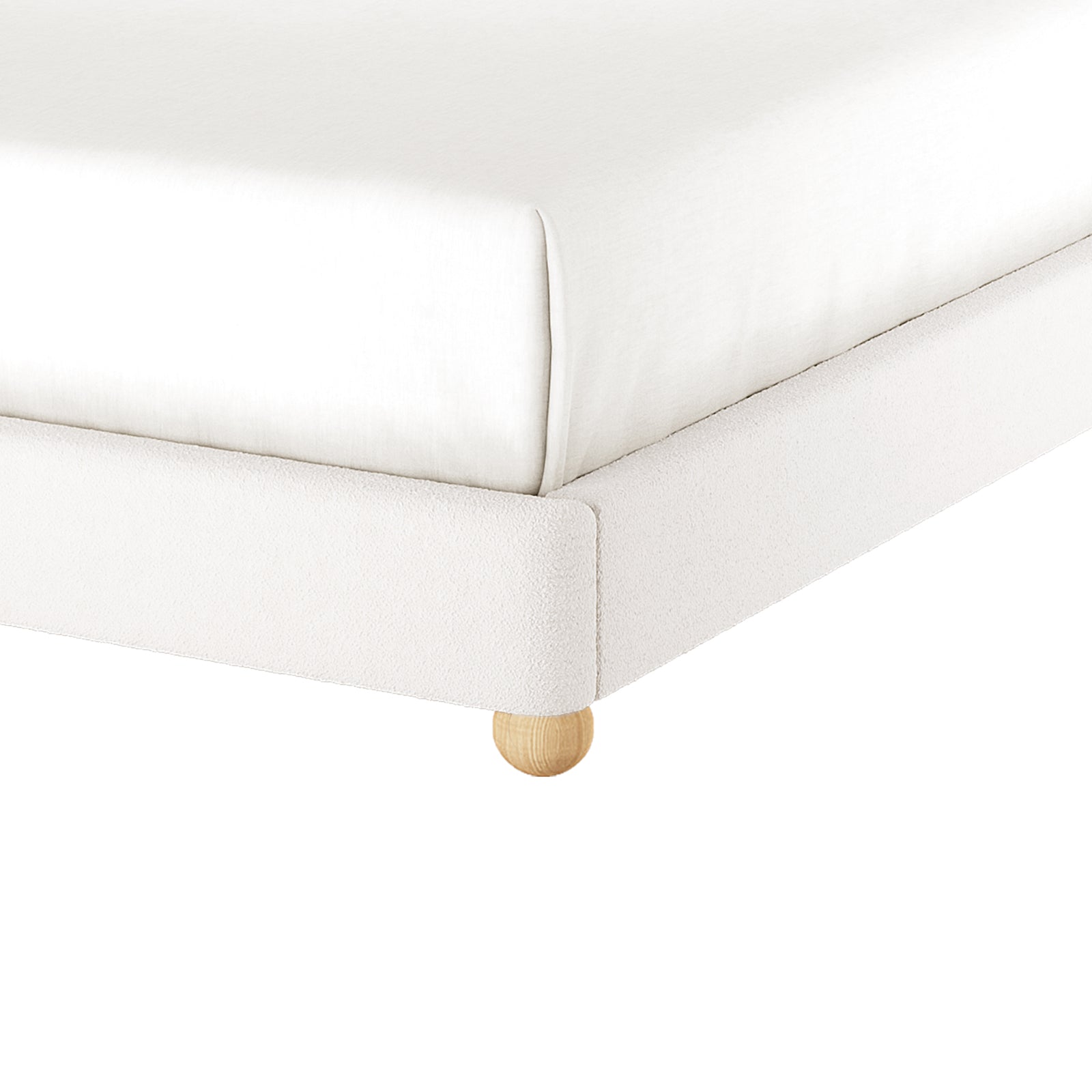Ginnie Bouclé Curved King Bed Frame - Cream White; close-up of white fabric frame with white mattress, on a round wooden foot, showcasing the elegant bouclé texture and sturdy construction.