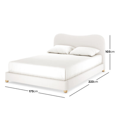 Ginnie Bouclé Curved Queen Bed Frame in Cream White features an off-white upholstered platform with a curved headboard, four wooden legs, and simple bedding, showcasing its elegant bouclé fabric and modern design.