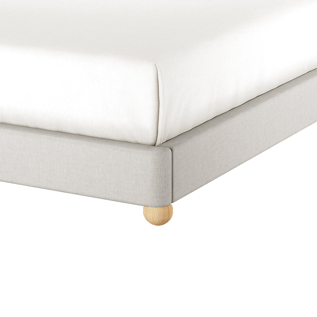 Close-up of the Ginnie Linen Curved Queen Bed Frame - Grey, showcasing the light-gray upholstered frame with a rounded wooden leg, and a mattress covered with a fitted white sheet.