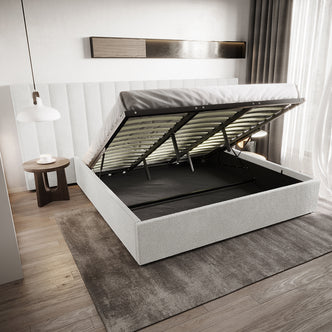 Aquila & Fabia Bed Package - Cream White King: Upholstered storage bed with gas-lift hinges, revealing large storage. Features wide headboard, wooden slats, light rug, round side table, and pendant lamp.