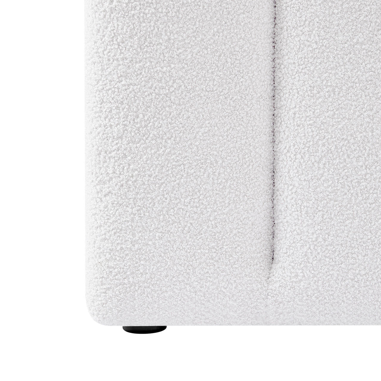 Close-up of Aquila King Extra Wide Bouclé Headboard in Cream White, showcasing the textured bouclé fabric, visible seam, and a small black foot at the base.