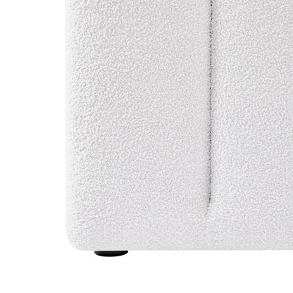 Close-up of Aquila King Extra Wide Bouclé Headboard in Cream White, showcasing the textured bouclé fabric, visible seam, and a small black foot at the base.