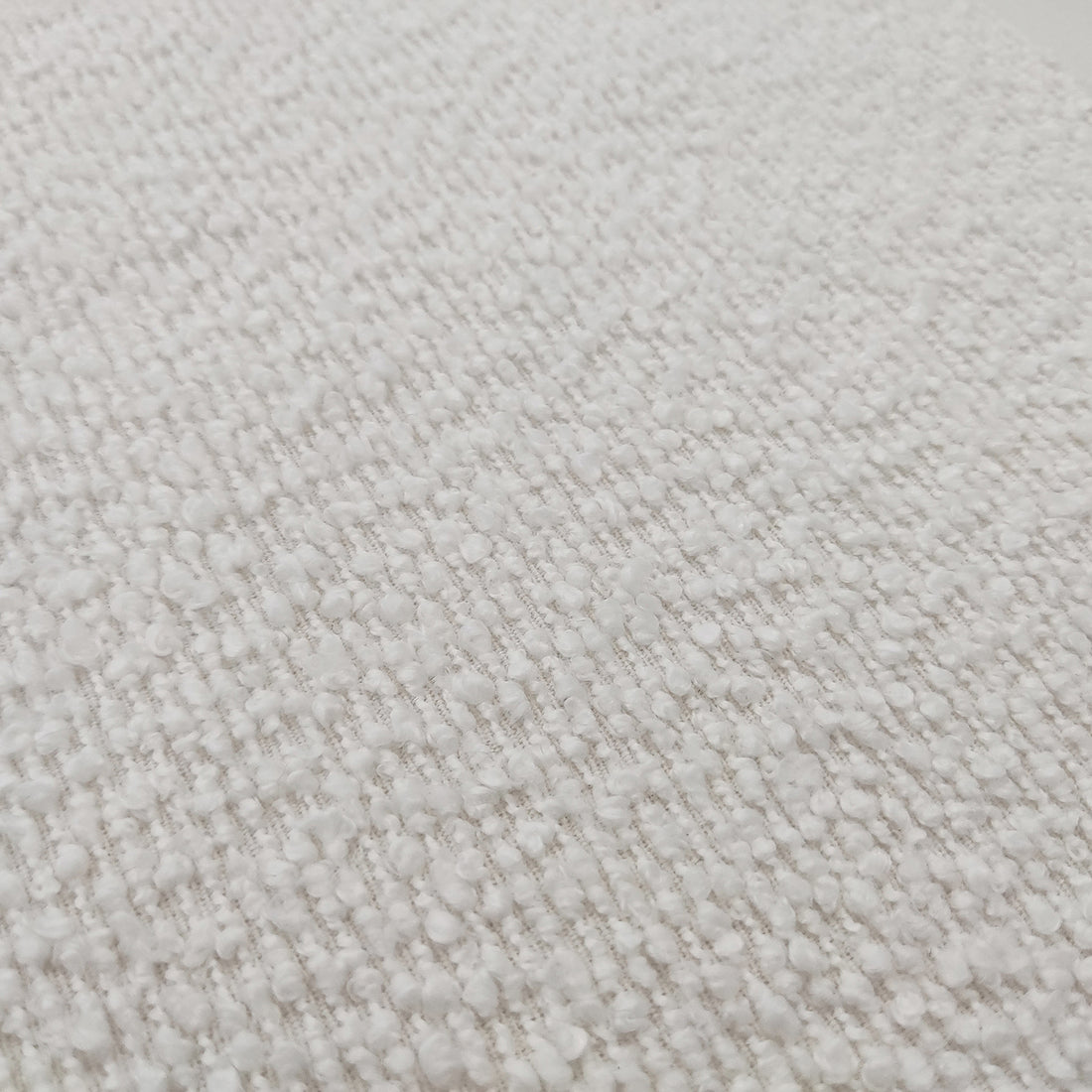 Harper Boucle Double Bed Frame in Eggshell White, featuring a close-up of its soft boucle fabric and timber accents, highlighting the modern and cozy design elements visible in the image.