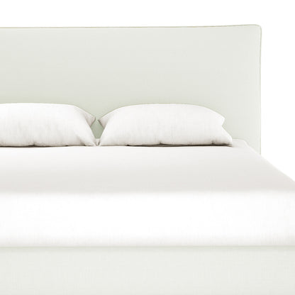 Havvan Double Linen Upholstered Fabric Bed Frame - Off White featuring a simple upholstered headboard, two white pillows, and a smooth white duvet, showcasing elegant off-white linen and plush foam-padded support.