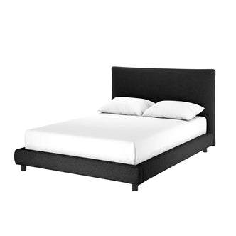 Havvan Queen Bouclé Upholstered Fabric Bed Frame - Black, featuring a low-profile design with a plush, foam-padded headboard and elegant flange-edge detailing, made up with white bedding and pillows.
