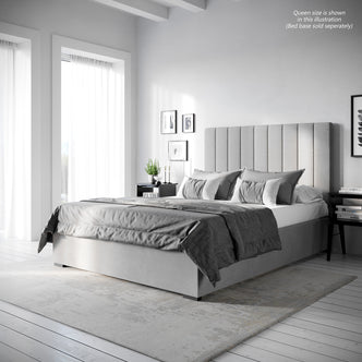 Gratiana Double Velvet Fabric Headboard in Slate features a tall, vertically channeled design with elegant stitching, set against a modern bedroom with grey-toned bedding and minimalist decor.