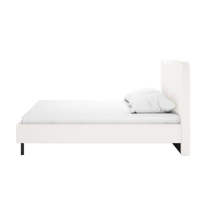 Kaylie Double Boucle Fabric Bed Frame in Cream White, featuring a tall, contoured headboard and low-profile frame on slender black legs, with a white mattress and pillows, showcasing minimalist elegance.