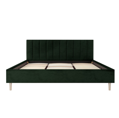 Kelly King Velvet Bed Frame – Dark Forest Green features a tufted black leather headboard, solid wood construction, and engineered slats, showcasing luxurious design and robust support for a regal bedroom centerpiece.