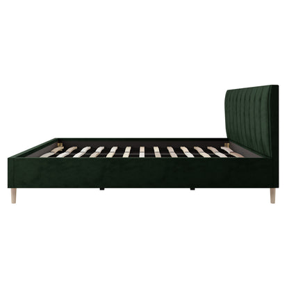 Kelly King Velvet Bed Frame in Dark Forest Green features a vertically tufted headboard and wooden slats, showcasing a luxurious and sturdy design ideal for enhancing bedroom elegance.
