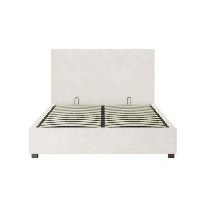 Lovita Double Bouclé Bed Frame with Gas Lift Storage features a minimalist design with cream upholstery, wooden slats for support, and metal handles above slats, resting on dark wooden block feet.
