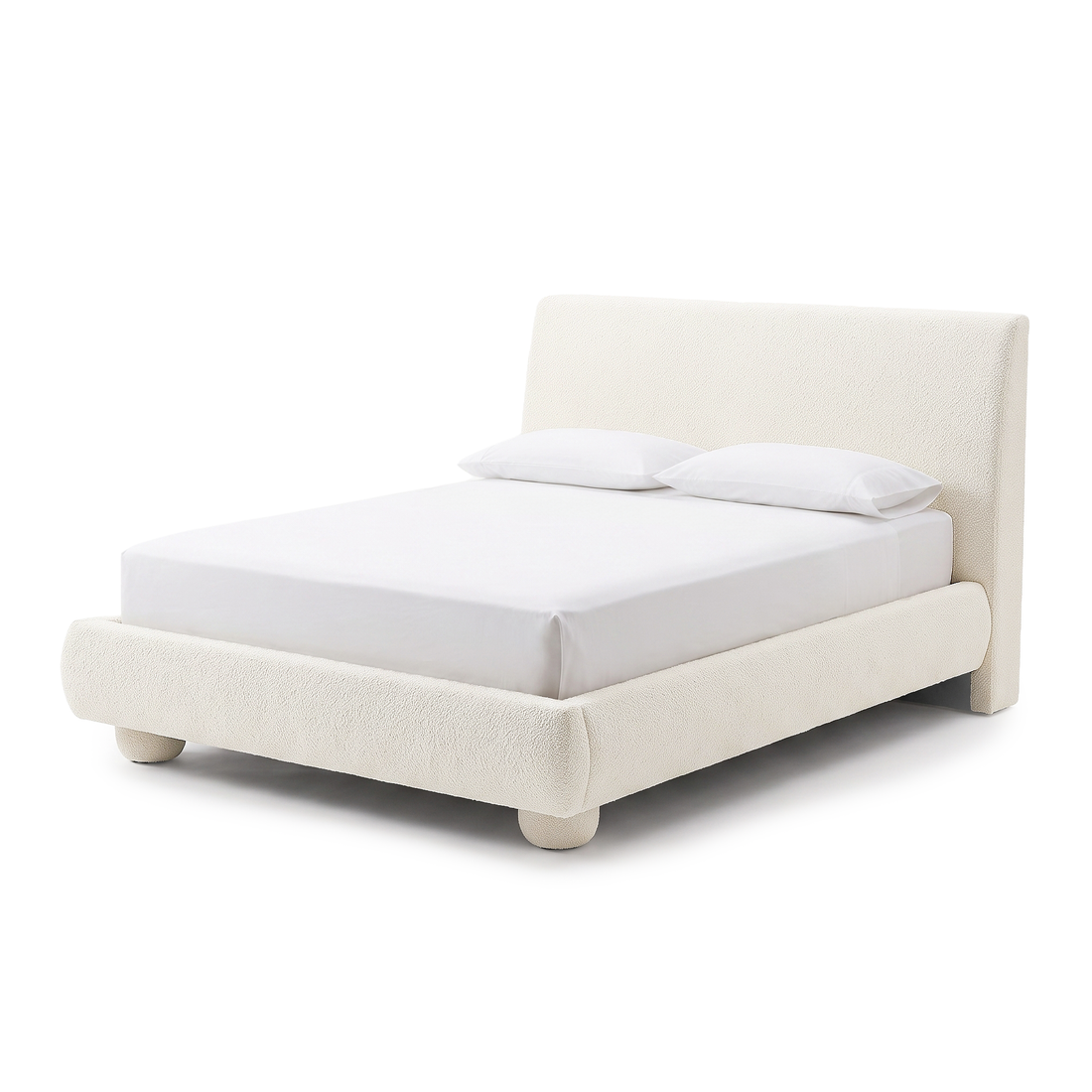 Modern upholstered bed on a white background with white bedding and pillows