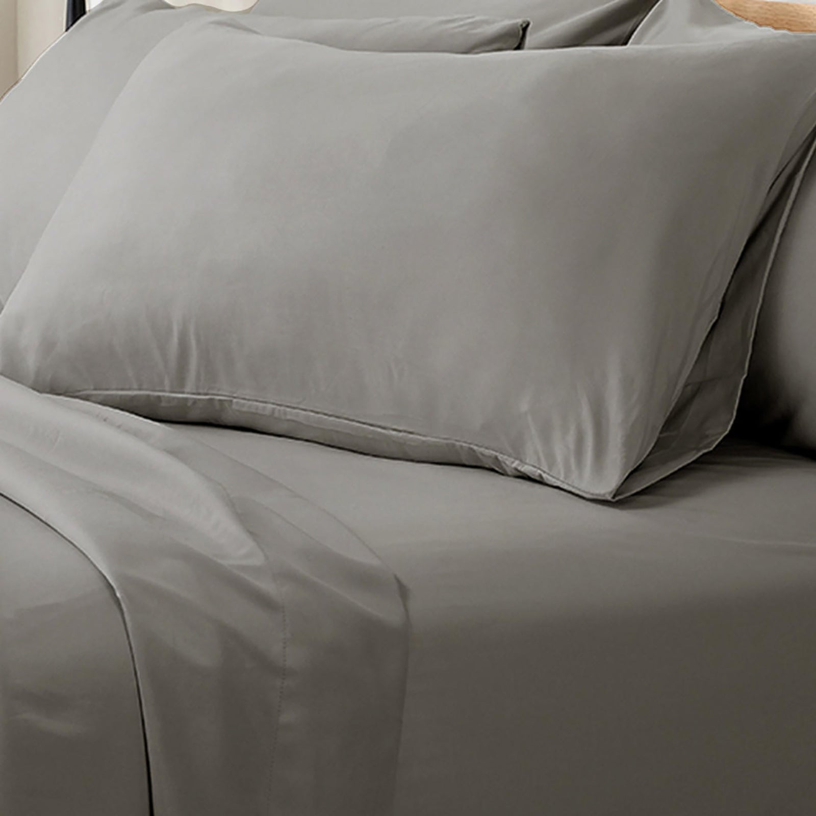 Valeria 1000TC Ultra Soft Bed Sheet Set King – Grey: Close-up of a plush, neatly arranged bed with smooth linens, highlighting the luxurious texture and fine craftsmanship of the bedding fabric.