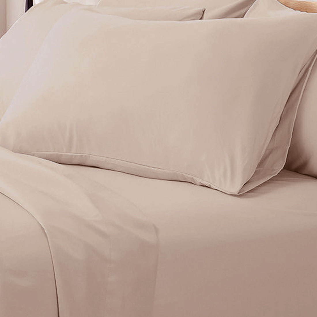 Valeria Single 1000TC Ultra Soft Bed Sheet Set in Cream, showcasing a neatly made bed with a matching beige pillow and smoothed sheet, highlighting its silky texture and luxurious appeal.