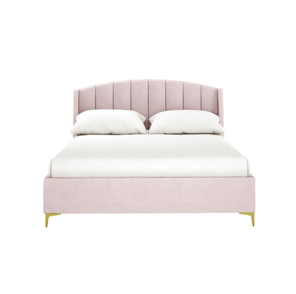 Lyra Velvet Bed Frame with Winged Headboard - Soft Pink Double features a blush-pink channel-stitched headboard, matching fabric frame, white bedding, and gold-tone legs against a white background.