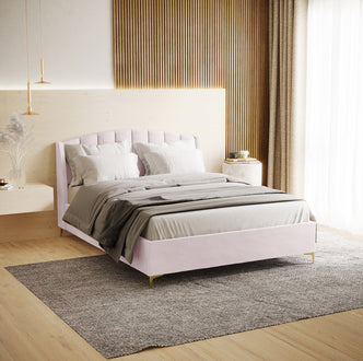 Lyra Velvet Bed Frame with Winged Headboard - Soft Pink Double, featuring a tufted headboard, neutral linens, and gold pendant lamps, creates a luxurious, serene bedroom setting.