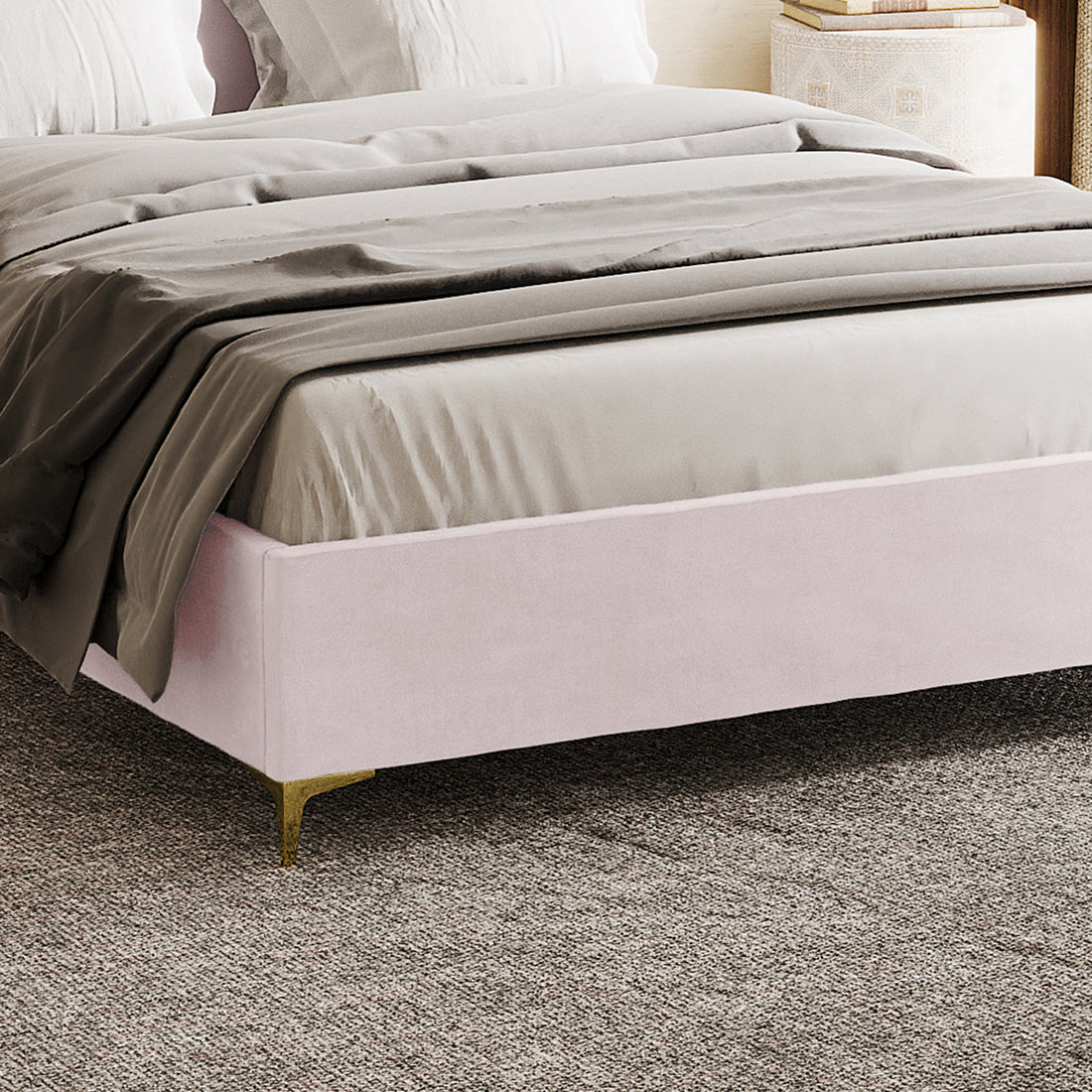 Lyra Velvet Bed Frame with Winged Headboard - Soft Pink Double, featuring blush-pink velvet upholstery, gold-metal legs, and a tufted headboard, topped with neutral sheets and a gray duvet.