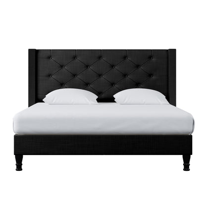 Maggie Queen Winged Fabric Bed Frame – Black, featuring a Chesterfield-style headboard and plush cushions, showcasing its luxurious design and durable construction with visible black fabric upholstery.