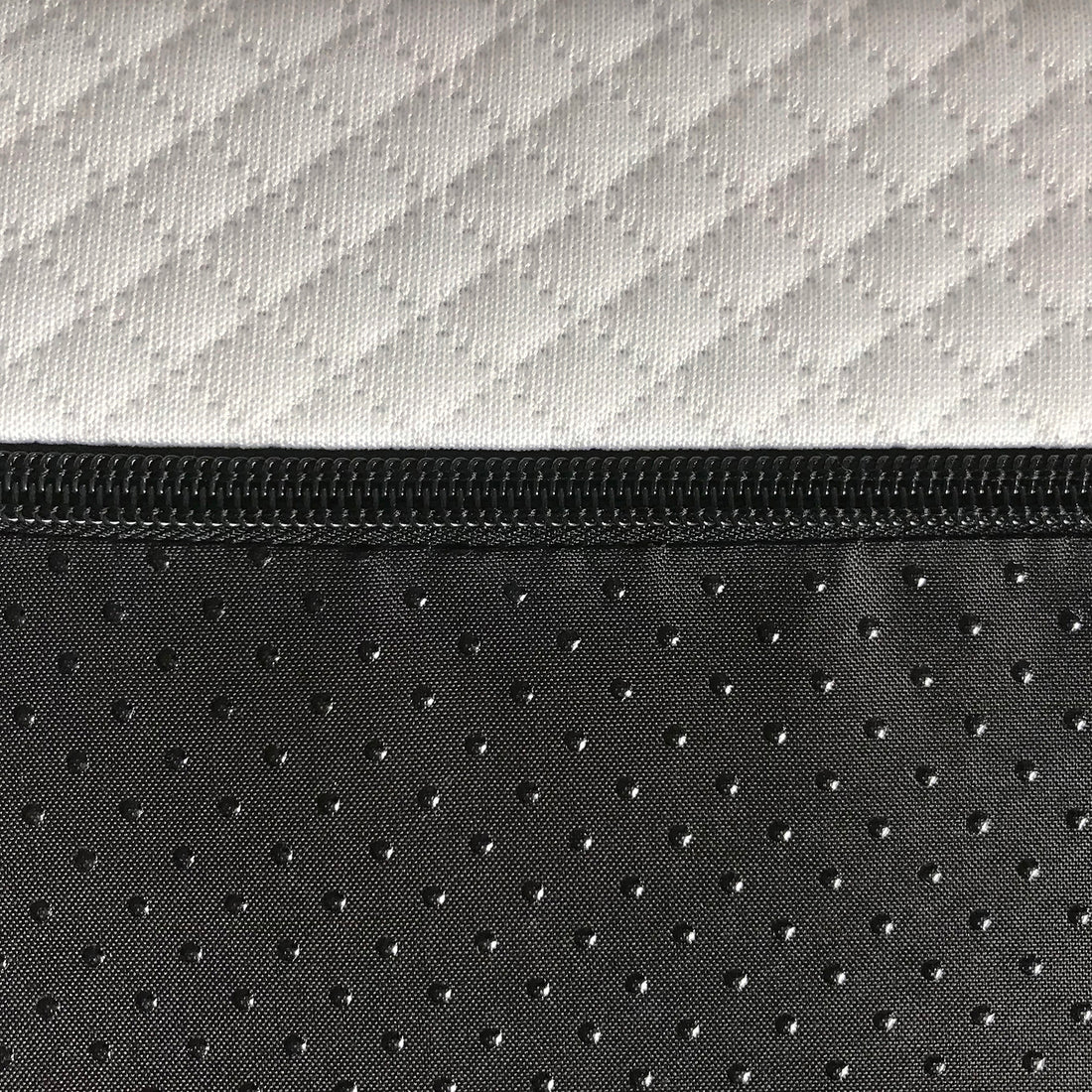 Close-up of the Calypso Single 20cm Knitted Bamboo Memory Foam Gel Mattress, showcasing the white quilted top and non-slip black dotted bottom, joined by a black zipper.