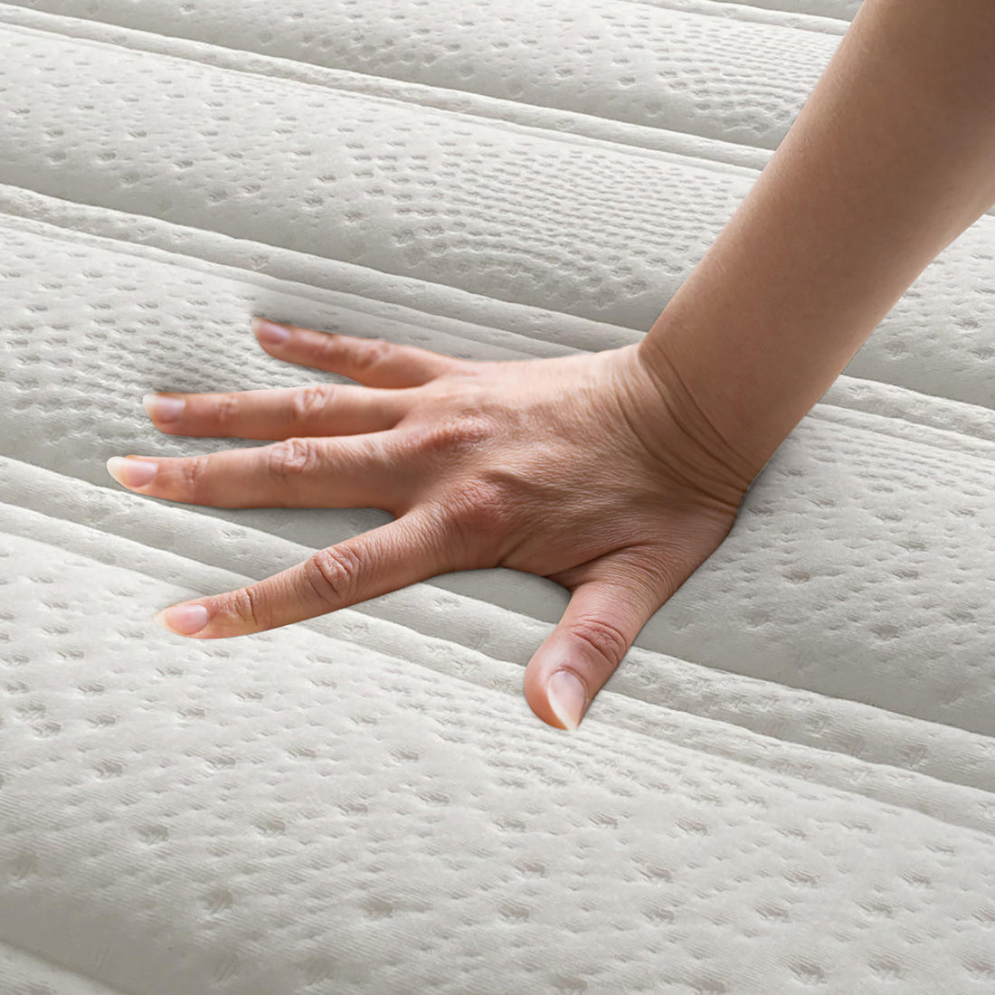 Delia King 28cm Medium Firm Euro Top Latex Mattress features a hand pressing its plush, contouring surface, highlighting its luxurious comfort and advanced support with visible Euro top quilting details.