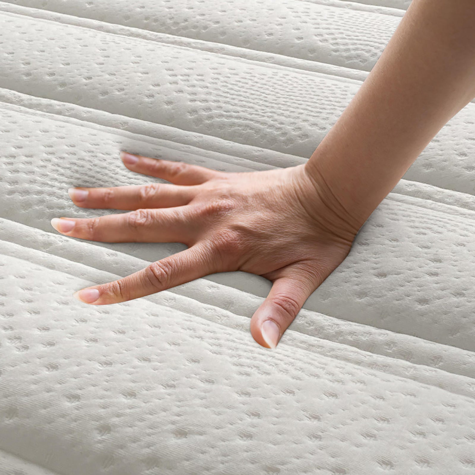 Delia King 28cm Medium Firm Euro Top Latex Mattress features a hand pressing its plush, contouring surface, highlighting its luxurious comfort and advanced support with visible Euro top quilting details.