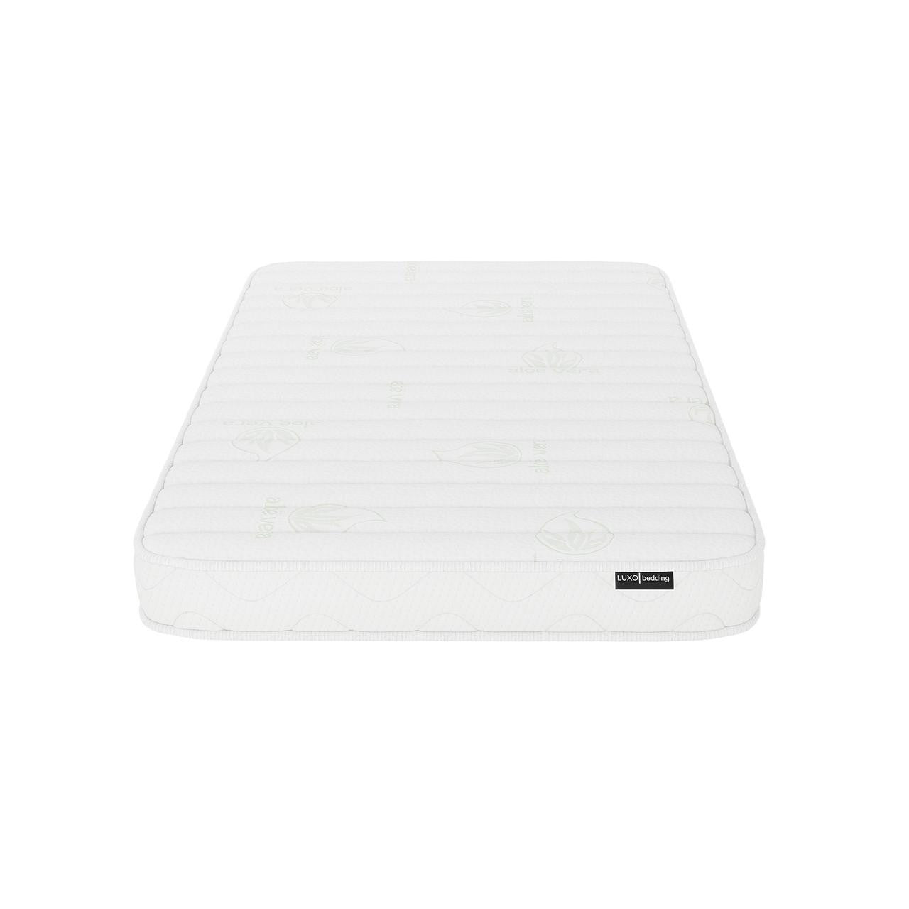 Gettel 10cm High-Density Foam Knitted Nursery Cot Mattress features a quilted cover with subtle stitched patterns and faint leaf motifs; visible LUXO bedding tag enhances its distinct design.