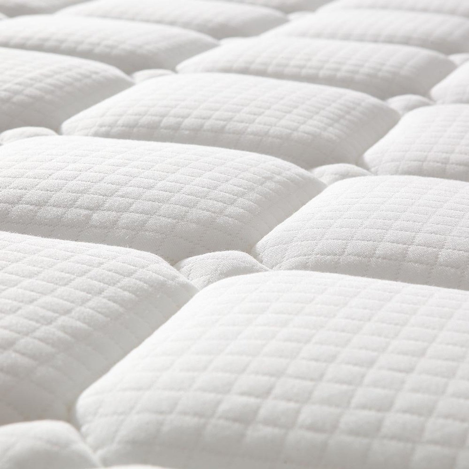 Luxo Venus Double Firm Pocket Spring Pillow Top Mattress close-up showing its firm foam pillow top and high-density pocket springs, highlighting durable support and reinforced edges for enhanced comfort and longevity.