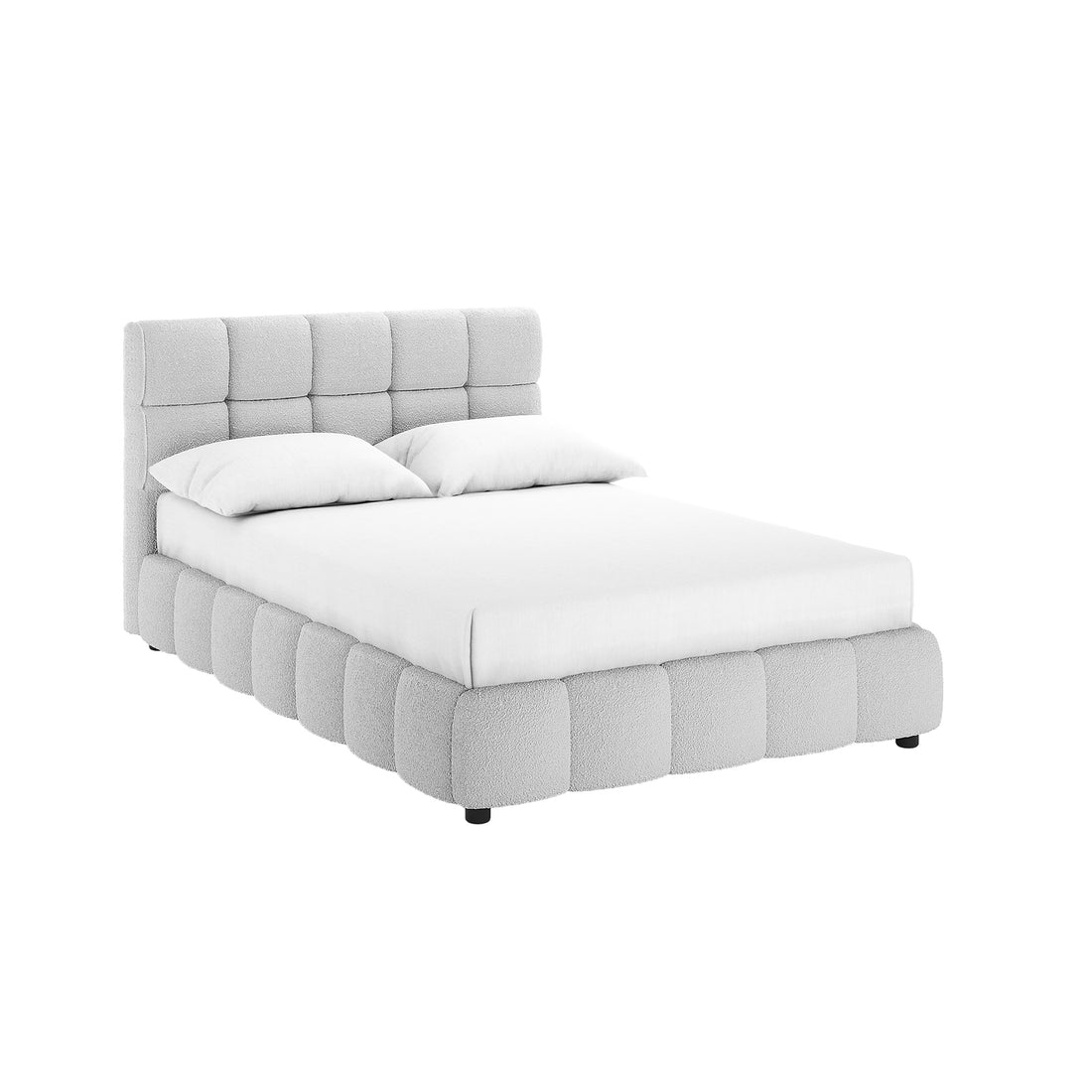 The Nikias Double Boucle Fabric Bed Frame in Light Grey features a padded, tufted headboard and low-profile base, both in soft bouclé fabric, atop small feet, with a fitted mattress and pillows.