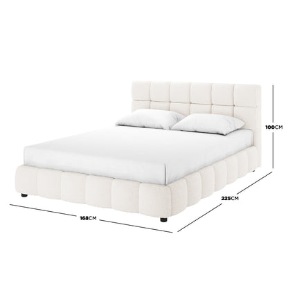 Nikias Queen Bouclé Fabric Bed Frame in Cream White features a plush, tufted headboard and padded base in off-white bouclé fabric, shown with a white mattress and pillows.