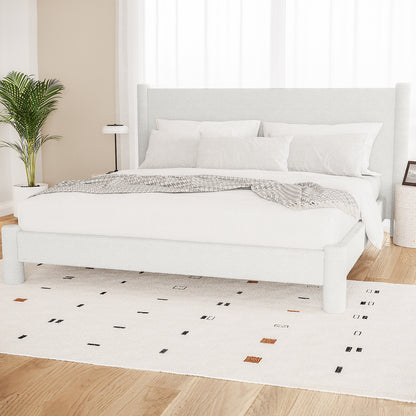 Rhoda King Upholstered Bouclé Bed in Cream White with a plush, rounded headboard and fully upholstered frame, showcasing luxurious bouclé fabric texture and solid wood construction for a grand bedroom centerpiece.