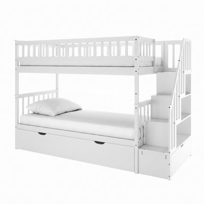 Sabbie Hardwood Single Storage Bunk Bed in White featuring two sleeping platforms, a pull-out trundle, boxed-in stairs with storage cubbies, and mattresses, showcasing a functional space-saving design.