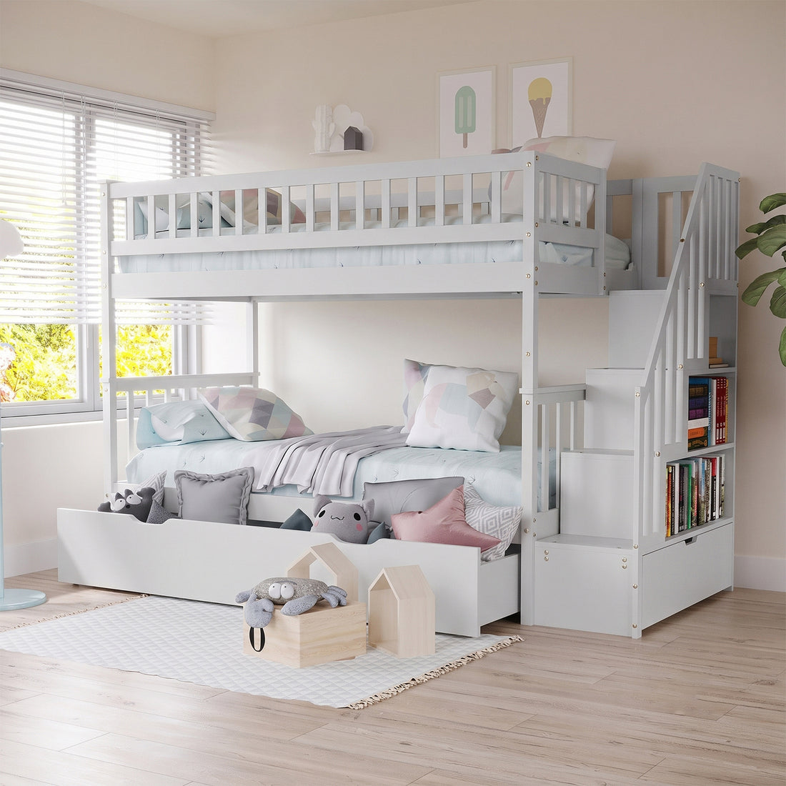 Sabbie Hardwood Single Storage Bunk Bed in White with top safety rails, pastel pillows, pull-out trundle, staircase with storage, and minimalist decor, perfect for space-saving and stylish kids’ rooms.