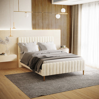 Seneca Double Upholstered Velvet Bed – Sandy White, showcasing a cream velvet frame with channel-tufted headboard, blends with minimalist decor, featuring a natural wood accent wall and floating nightstands.