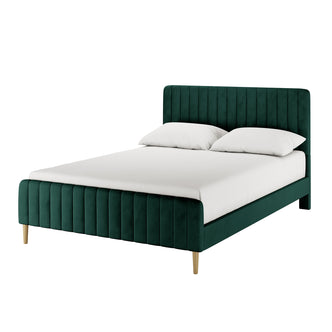 Seneca Double Upholstered Velvet Bed – Green features a luxurious emerald-green velvet frame, with vertically channel-tufted headboard and footboard, supported by slender wooden legs, and accented with white bedding.
