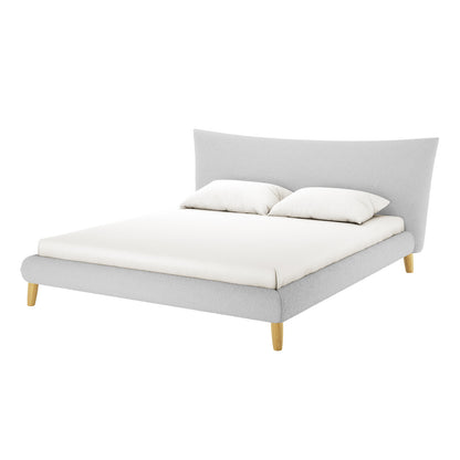 Estilla Boucle Upholstered Rainbow Single Bed features a cream white low-profile design with a gently curved headboard, simple padded side rails, and four short wooden legs, complemented by white bedding and pillows.