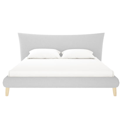 Estilla Boucle Upholstered Rainbow Single Bed features a modern light-gray design with a flared headboard, low footboard, and four tapered wooden legs, dressed in a white fitted sheet and pillows.