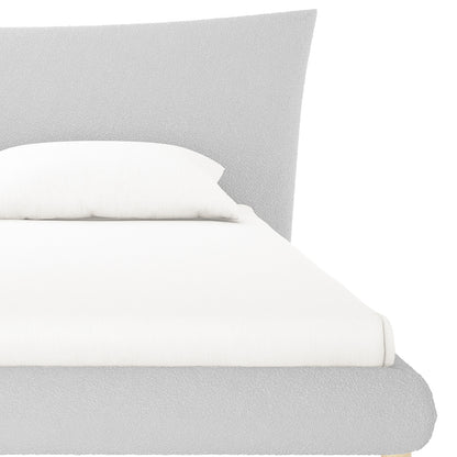 Estilla Boucle Upholstered Rainbow Single Bed features a low-profile platform frame with a textured headboard, fitted with a white sheet and pillow, offering a sleek, modern look.