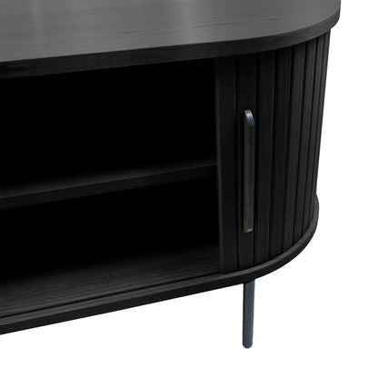 Aaron 160cm Fluted TV Unit - Black: Close-up of black wood-grain cabinet with rounded, fluted doors, slim vertical handle, open shelf, and slim metal legs, showcasing its modern, elegant design.
