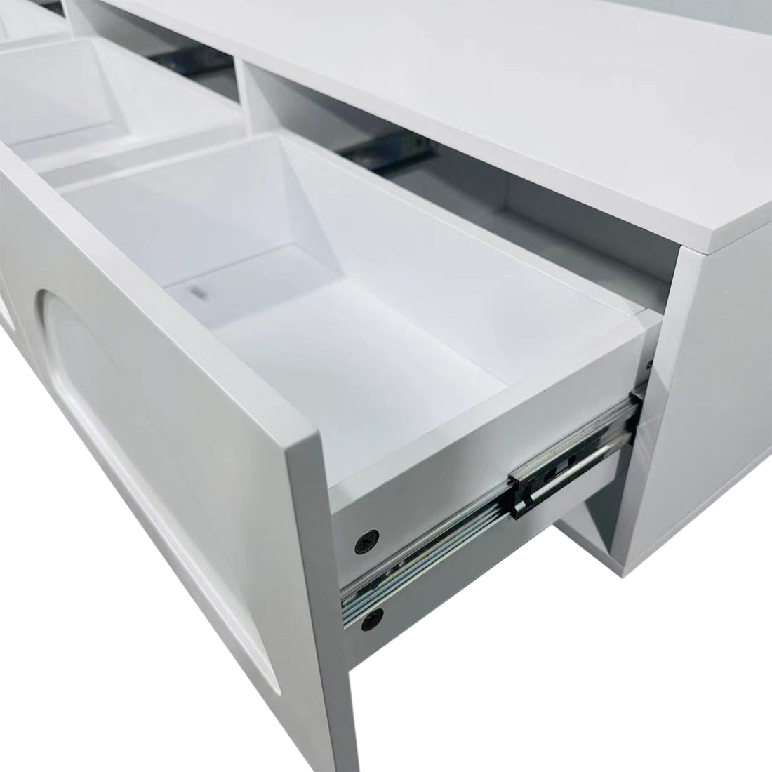 Archen 200cm 4 Drawer Storage TV Entertainment Unit in White, showcasing a minimal design with smooth panels. One drawer partially open, revealing interior and metal slides for sleek storage.